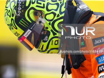 Lando Norris emerges from his car after winning a sprint race at Circuit of the Americas in Austin, Texas, on October 19, 2024, during the F...