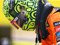 Lando Norris emerges from his car after winning a sprint race at Circuit of the Americas in Austin, Texas, on October 19, 2024, during the F...