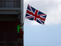 A fan waves the Union Jack during a sprint race at Circuit of the Americas in Austin, Texas, on October 19, 2024, during the Formula 1 Pirel...