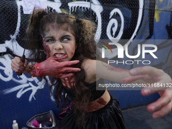 A minor poses during the Zombie March in Mexico City, Mexico, on October 19, 2024, which starts from the Monument to the Revolution to the Z...