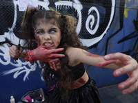 A minor poses during the Zombie March in Mexico City, Mexico, on October 19, 2024, which starts from the Monument to the Revolution to the Z...