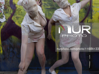 Two women dressed as nurses pose during the Zombie March in Mexico City, Mexico, on October 19, 2024. The march starts from the Monument to...