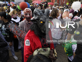 Dozens of people dressed in costume participate in the Zombie March in Mexico City, Mexico, on October 19, 2024, which starts from the Monum...