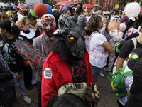 Dozens of people dressed in costume participate in the Zombie March in Mexico City, Mexico, on October 19, 2024, which starts from the Monum...