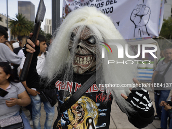 A woman dresses as an Iron Maiden during the Zombie March in Mexico City, Mexico, on October 19, 2024, which starts from the Monument to the...