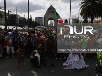 Dozens of people dressed in costume participate in the Zombie March in Mexico City, Mexico, on October 19, 2024, which starts from the Monum...