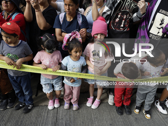 Dozens of people dressed in costume participate in the Zombie March in Mexico City, Mexico, on October 19, 2024, which starts from the Monum...