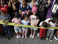 Dozens of people dressed in costume participate in the Zombie March in Mexico City, Mexico, on October 19, 2024, which starts from the Monum...