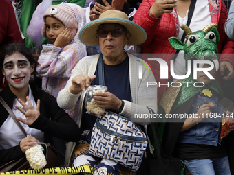 Dozens of people dressed in costume participate in the Zombie March in Mexico City, Mexico, on October 19, 2024, which starts from the Monum...