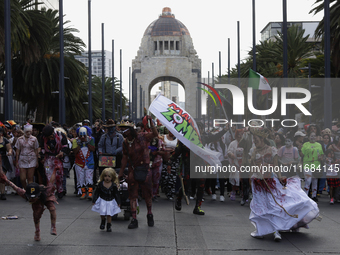 Dozens of people dressed in costume participate in the Zombie March in Mexico City, Mexico, on October 19, 2024, which starts from the Monum...