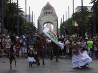 Dozens of people dressed in costume participate in the Zombie March in Mexico City, Mexico, on October 19, 2024, which starts from the Monum...