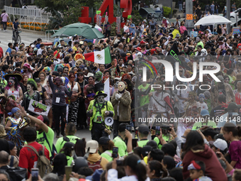 A person dresses as the horror movie character Jason during the Zombie March in Mexico City, Mexico, on October 19, 2024, which starts from...