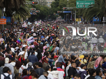 Dozens of people dressed in costume participate in the Zombie March in Mexico City, Mexico, on October 19, 2024, which starts from the Monum...