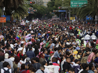 Dozens of people dressed in costume participate in the Zombie March in Mexico City, Mexico, on October 19, 2024, which starts from the Monum...