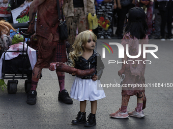 Dozens of people dressed in costume participate in the Zombie March in Mexico City, Mexico, on October 19, 2024, which starts from the Monum...