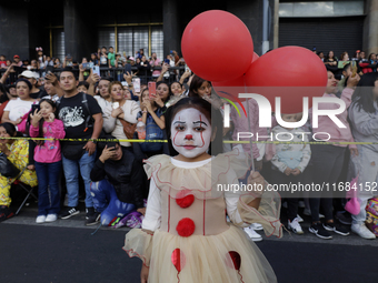 A minor poses dressed as the character It during the Zombie March in Mexico City, Mexico, on October 19, 2024, which starts from the Monumen...