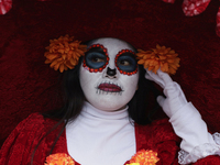 A woman dresses as a catrina during the Zombie March in Mexico City, Mexico, on October 19, 2024, which starts from the Monument to the Revo...