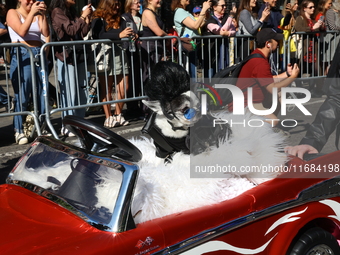 A dog is pushed in an old-style Chevy during the 34th Annual Tompkins Square Halloween Dog Parade in Tompkins Square Park in New York City,...