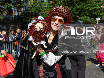 A woman and her dog wear matching costumes with wigs for the 34th Annual Tompkins Square Halloween Dog Parade in Tompkins Square Park in New...