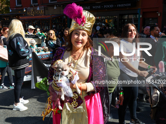 A woman and her dog participate in the 34th Annual Tompkins Square Halloween Dog Parade in Tompkins Square Park in New York City, United Sta...