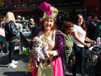 A woman and her dog participate in the 34th Annual Tompkins Square Halloween Dog Parade in Tompkins Square Park in New York City, United Sta...