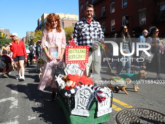 The owners of these dogs make a Beetlejuice-themed cart for the 34th Annual Tompkins Square Halloween Dog Parade in Tompkins Square Park in...