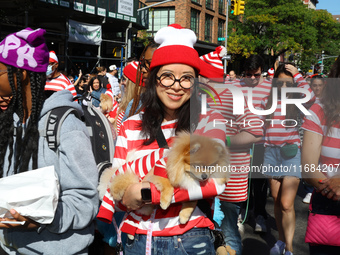 Pomeranian owners and their dogs dress up for the 34th Annual Tompkins Square Halloween Dog Parade in Tompkins Square Park in New York City,...