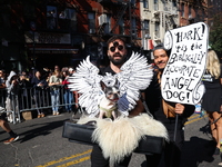 Owners and their dog dress as angels for the 34th Annual Tompkins Square Halloween Dog Parade in Tompkins Square Park in New York City, USA,...