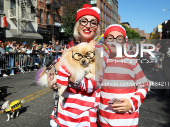 A Pomeranian owner and their dog dress up for the 34th Annual Tompkins Square Halloween Dog Parade in Tompkins Square Park in New York City,...