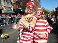 A Pomeranian owner and their dog dress up for the 34th Annual Tompkins Square Halloween Dog Parade in Tompkins Square Park in New York City,...