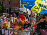 A family and pets dress as a hot dog stand for the 34th Annual Tompkins Square Halloween Dog Parade in Tompkins Square Park in New York City...