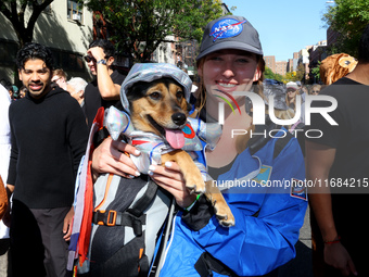 A woman and her dog dress for space travel for the 34th Annual Tompkins Square Halloween Dog Parade in Tompkins Square Park in New York City...