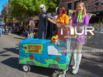 Scooby Doo themed costumes with a Mystery Machine cart for dogs and owners appear at the 34th Annual Tompkins Square Halloween Dog Parade in...