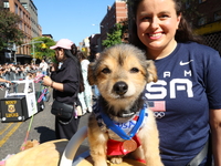 A dog and owner dress as Olympic medalists for the 34th Annual Tompkins Square Halloween Dog Parade in Tompkins Square Park in New York City...