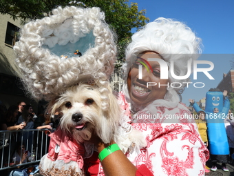 An owner and her dog Queen Charlotte look happy during the 34th Annual Tompkins Square Halloween Dog Parade in Tompkins Square Park in New Y...