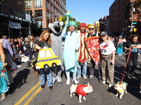 A group of friends and a dog represent NYC icons for the 34th Annual Tompkins Square Halloween Dog Parade in Tompkins Square Park in New Yor...