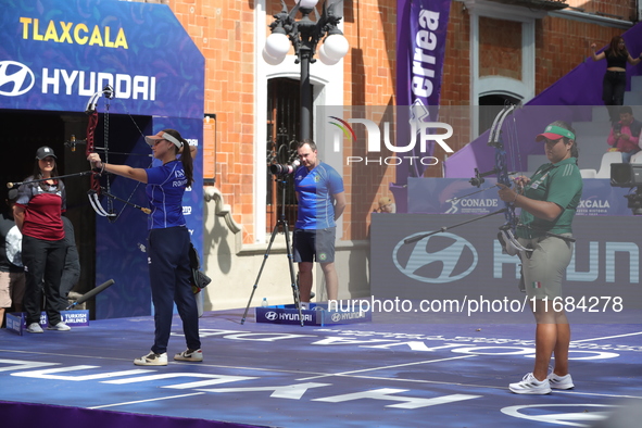 Elisa Roner of Italy and Andrea Maya Becerra of Mexico compete during the compound women's quarterfinals match on the second day of the Tlax...