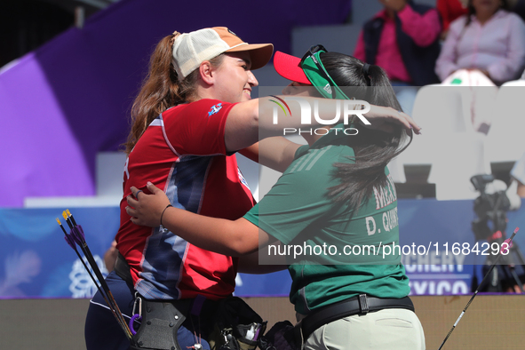 Dafne Quintero of Mexico and Ella Gibson of Great Britain compete during the compound women's quarterfinals match on the second day of the T...