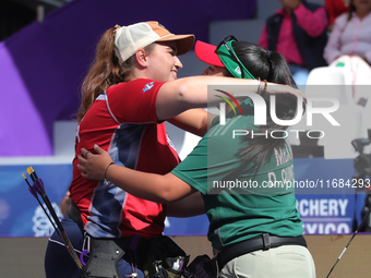 Dafne Quintero of Mexico and Ella Gibson of Great Britain compete during the compound women's quarterfinals match on the second day of the T...