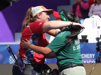 Dafne Quintero of Mexico and Ella Gibson of Great Britain compete during the compound women's quarterfinals match on the second day of the T...