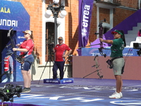 Dafne Quintero of Mexico and Ella Gibson of Great Britain compete during the compound women's quarterfinals match on the second day of the T...