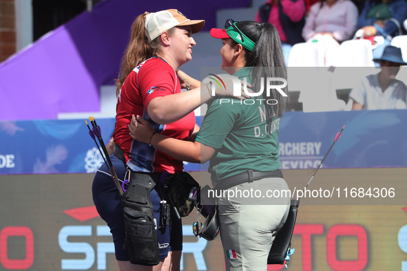 Dafne Quintero of Mexico and Ella Gibson of Great Britain compete during the compound women's quarterfinals match on the second day of the T...