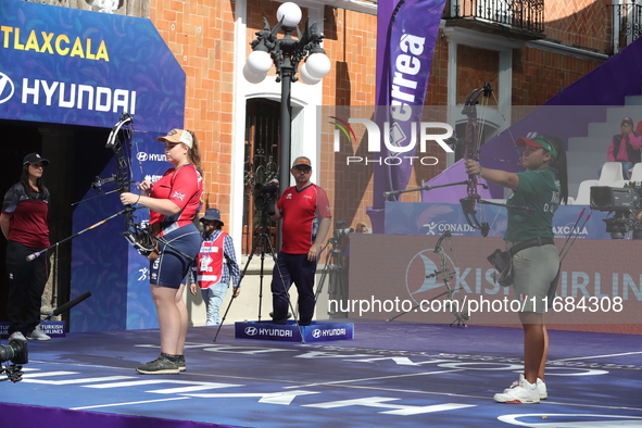 Dafne Quintero of Mexico and Ella Gibson of Great Britain compete during the compound women's quarterfinals match on the second day of the T...