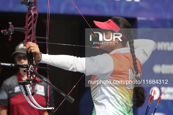 Jyothi Surekha of Vennam competes against Meeri-Marita Pass of Estonia (not in picture) during the compound women's quarterfinals match on t...