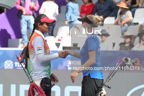 Jyothi Surekha of Vennam and Meeri-Marita Pass of Estonia compete during the compound women's quarterfinals match on the second day of the T...