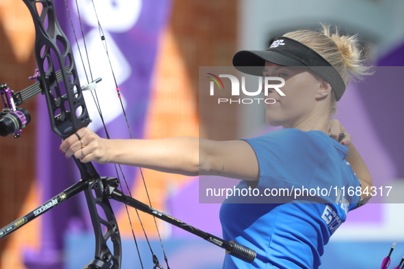 Meeri-Marita Pass of Estonia competes against Jyothi Surekha of Vennam (not in picture) during the compound women's quarterfinals match on t...