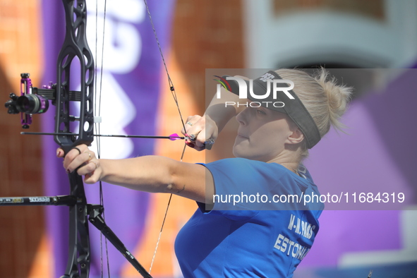 Meeri-Marita Pass of Estonia competes against Jyothi Surekha of Vennam (not in picture) during the compound women's quarterfinals match on t...