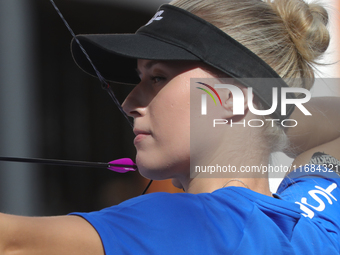 Meeri-Marita Pass of Estonia competes against Jyothi Surekha of Vennam (not in picture) during the compound women's quarterfinals match on t...