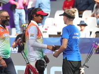 Jyothi Surekha of Vennam and Meeri-Marita Pass of Estonia compete during the compound women's quarterfinals match on the second day of the T...