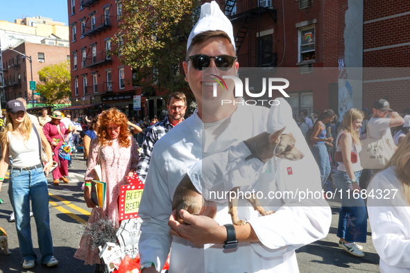 A dog and his owner dress as chefs for the 34th Annual Tompkins Square Halloween Dog Parade in Tompkins Square Park in New York City, USA, o...